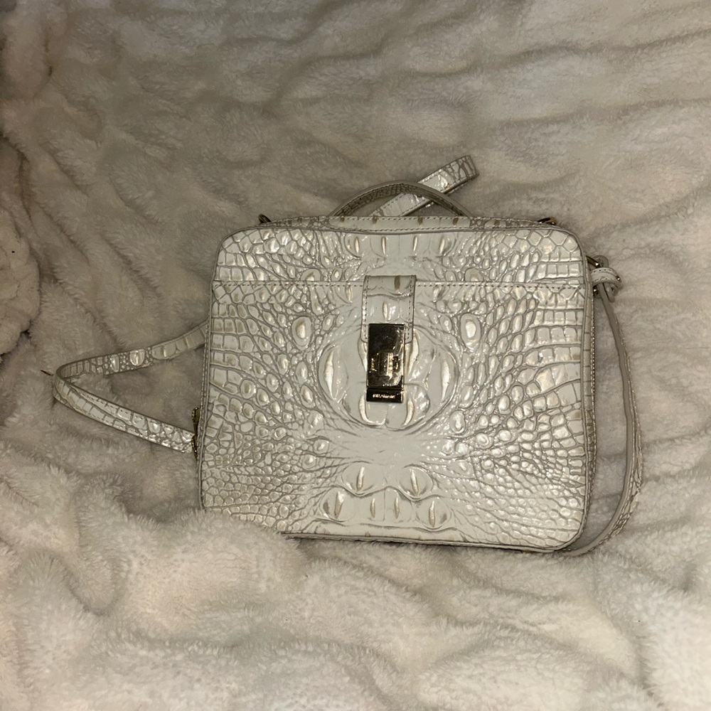 Elegant White Brahmin Women's handbag with strap.